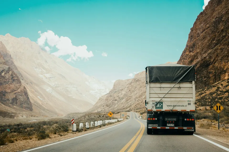 Delivery truck driving on a desert highway